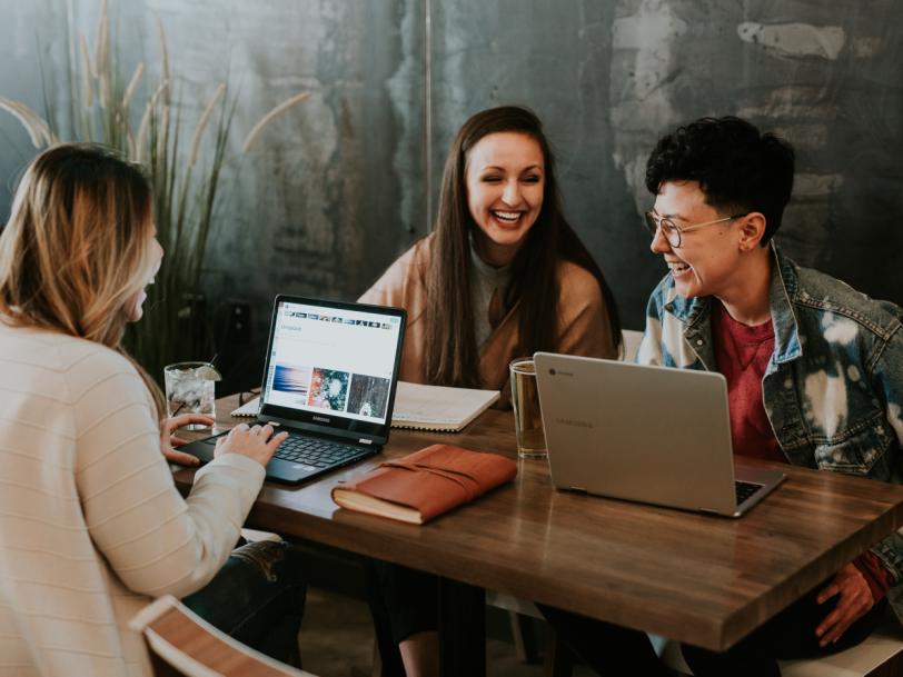 A group of people with laptops